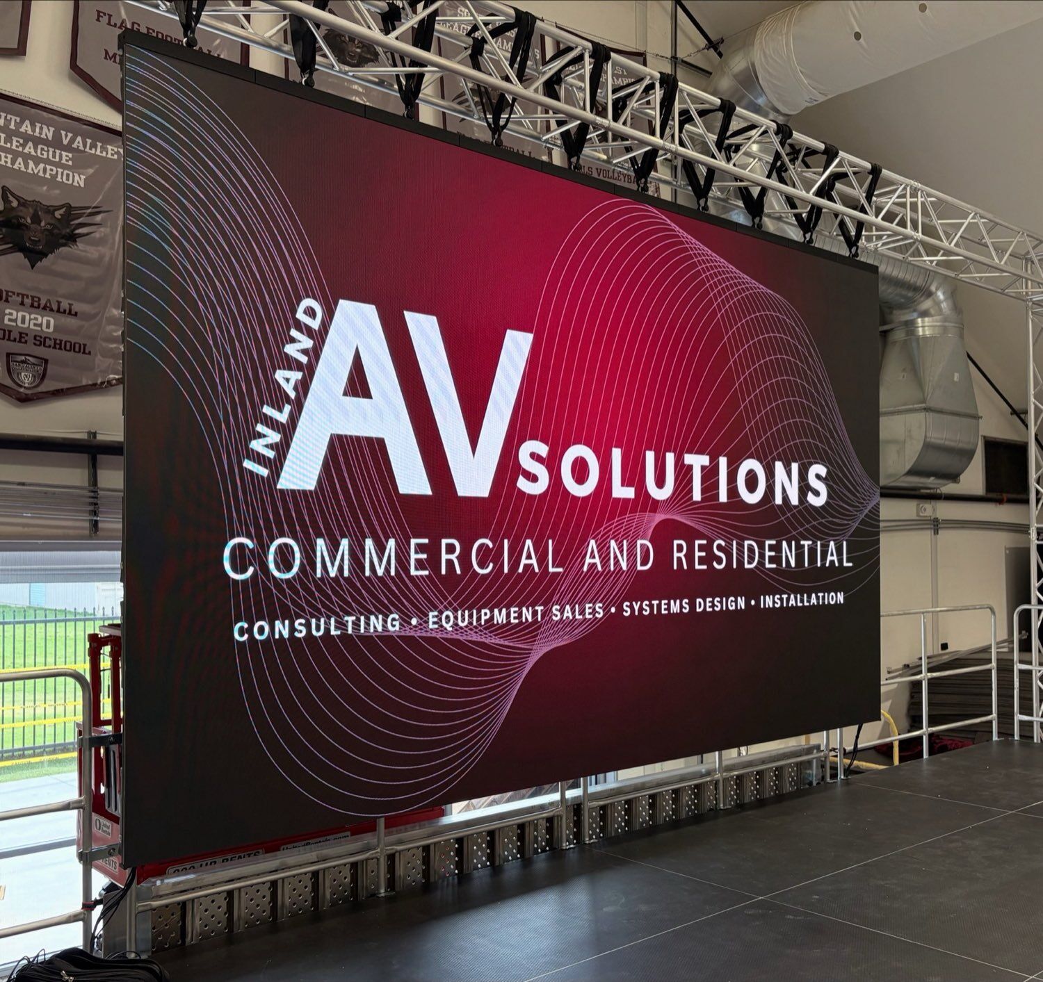 Large-format LED video wall driving branded digital signage content in a commercial space